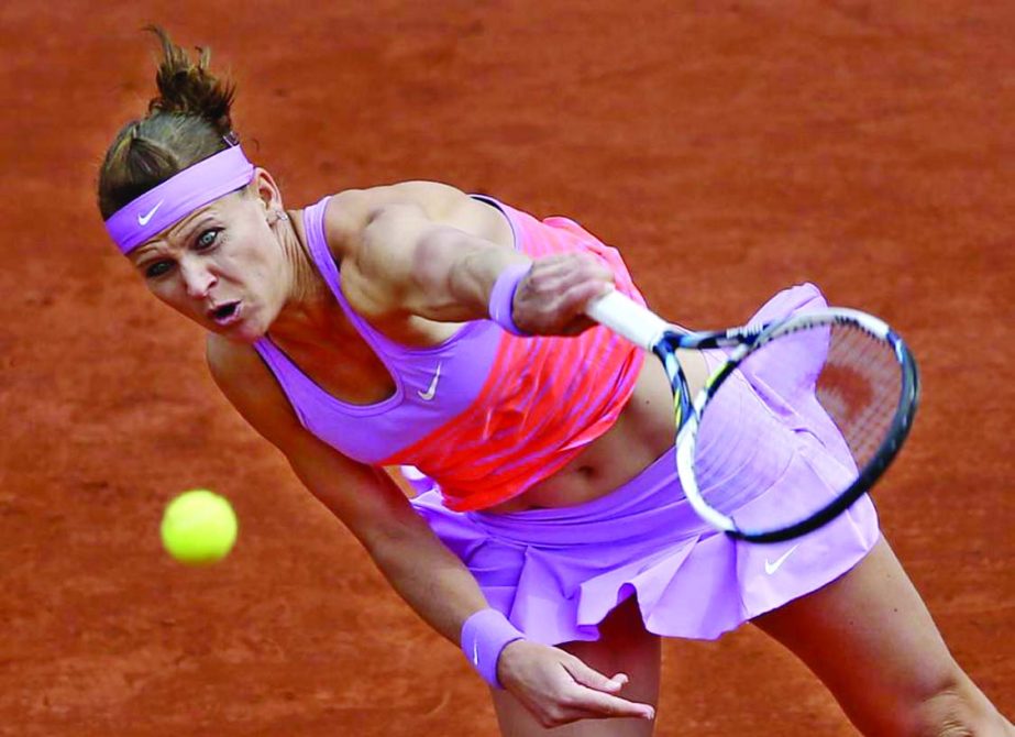 Lucie Safarova of the Czech Republic serves the ball to Russia's Maria Sharapova during their fourth round match of the French Open tennis tournament at the Roland Garros stadium in Paris, France on Monday.