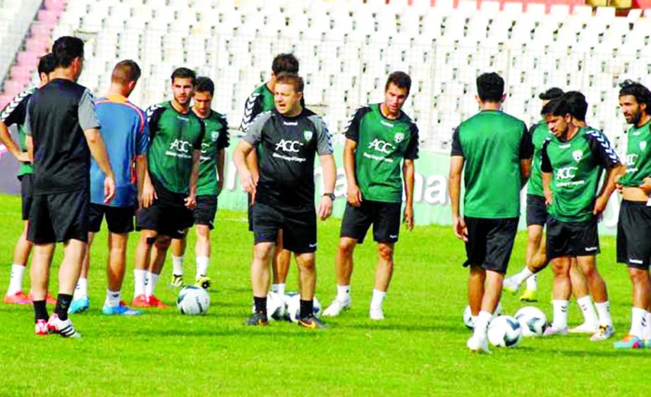 Players of Afghanistan football team during a practice session at the Bangabandhu National Stadium on Monday.