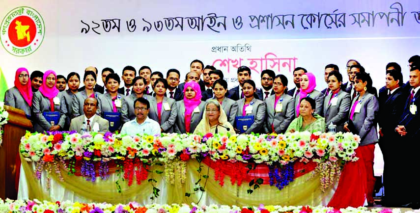 Prime Minister Sheikh Hasina along with the participants in a concluding 92nd and 93rd Law and Administration Course poses for photograph at BCS Administration Academy in the city's Shahbagh on Tuesday. BSS photo