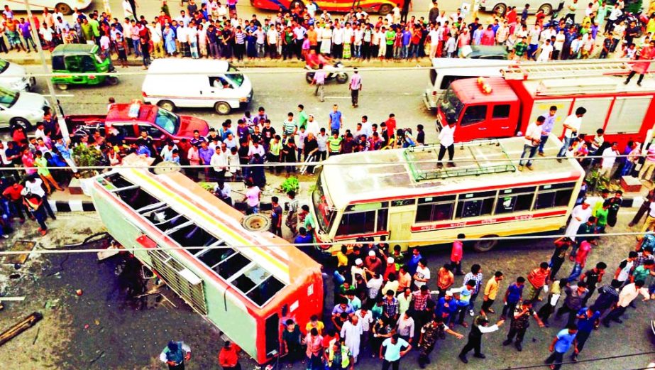 A Gabtoli-Jatrabari Bus Services was overturned while collided head on with another bus at Kawranbazar area in city on Wednesday killing one passenger and injured many others.