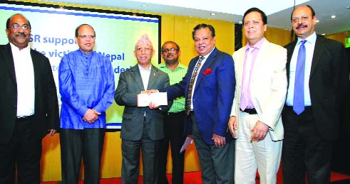 MA Hashem, Chairman of United Commercial Bank, handing over a cheque of Tk 1crore to Hari Kumar Shrestha, Ambassador of Nepal for earthquake victims of Nepal at a city hotel recently. BB Governor Dr Atiur Rahman, Deputy Governor SK Sur Chowdhury and Execu