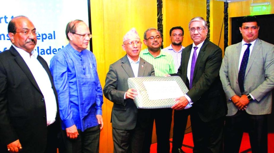 Nepal Ambassador Hari Kumar Shrestha receiving 1500 pieces of tarpaulin from Kamal Khan Chowdhury, Managing Director of Prime Bank Limited for earthquake victims of Nepal at a city hotel recently. BB Governor Dr Atiur Rahman, Deputy Governor SK Sur Chowdh