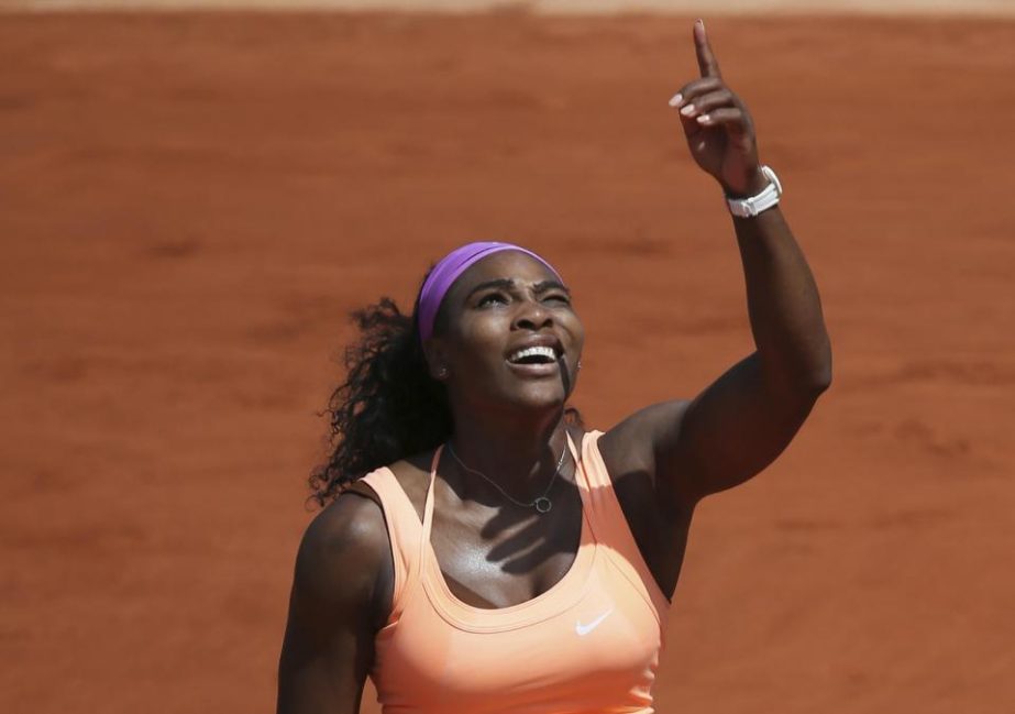 Serena Williams of the U.S. gestures she has trouble returning a high ball against the sunlight in the quarterfinal match of the French Open tennis tournament against Italy's Sara Errani at the Roland Garros stadium, in Paris, France, Wednesday. Williams