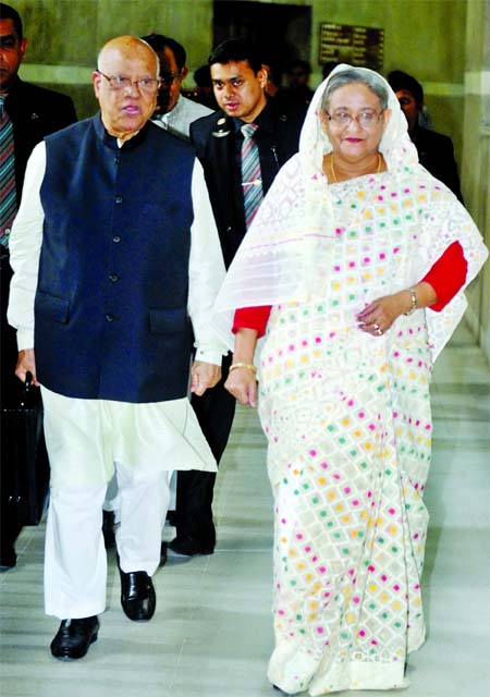 Prime Minister Sheikh Hasina and Finance Minister Abul Maal Abdul Muhith entering the House on Thursday. Muhith carrying the brief case containing papers of ambitious budget. Photo: BSS