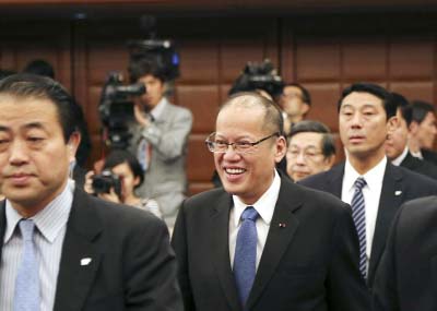 Philippine President Benigno Aquino III arrives for a press conference at the Japan National Press Club in Tokyo on Friday.