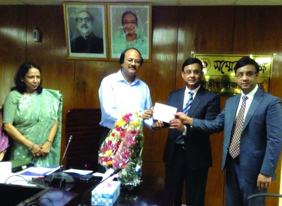 Md Nojibur Rahman, Chairman of National Board of Revenue, handing over CIP cards among the recipients at the conference room of NBR in the city recently.