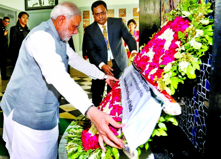 Visiting Indian Prime Minister Narendra Modi paying tributes to the Father of the Nation Bangabandhu Sheikh Mujibur Rahman by placing floral wreaths at the portrait of Bangabandhu at Bangabandhu Memorial Museum in the city's 32, Dhanmondi on Saturday.