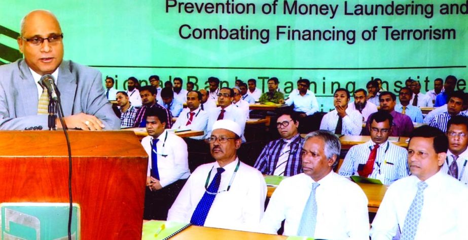 Syed Mohammad Bariqullah, Deputy Managing Director and CAMALCO of National Bank Limited, addressing a daylong workshop on 'Prevention of Money Laundering and Combating Financing of Terrorism' at its training institute in the city recently.