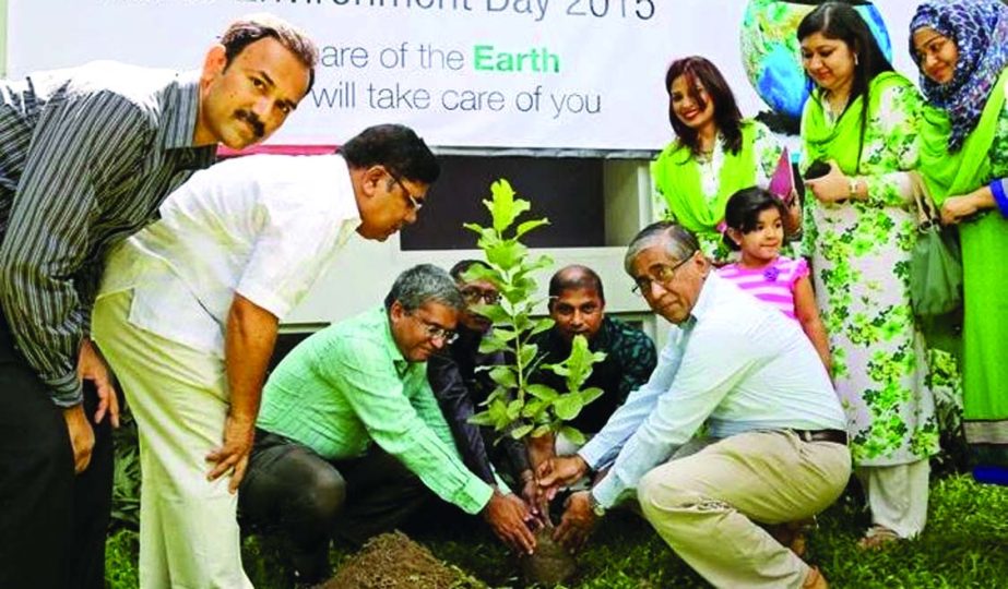 Ahmed Kamal Khan Chowdhury, Managing Director of Prime Bank Limited, planting a tree in Gulshan Branch premises of the bank to mark the World Environment Day 2015. Deputy Managing Director Md Touhidul Alam Khan were present.