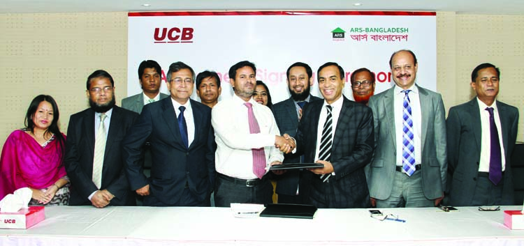 M Shahidul Islam, Additional Managing Director of United Commercial Bank and Md Shamsul Alam, Executive Director of ARS-Bangladesh sign an agreement on Monday. Under this deal the bank disbursed Tk70 lakh to 10 Taka account holders through MFI under refin