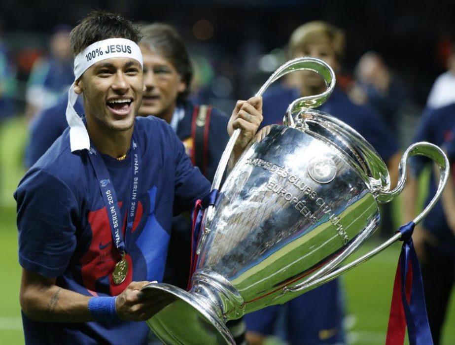 Barcelona's Neymar celebrates with the trophy after the Champions League final soccer match between Juventus Turin and FC Barcelona at the Olympic stadium in Berlin Saturday (June 6). Barcelona won the match 3-1.