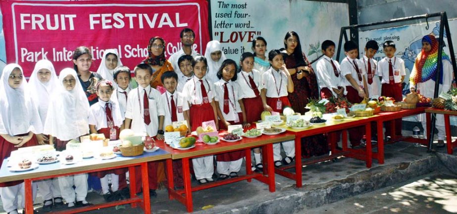 Students are seen at a fruit festival at Park International School and College at Khilgoan in the city recently.