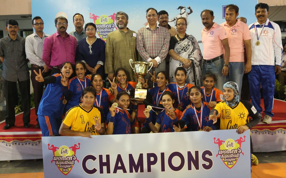 Dhaka Mariner Youngs Club, the champions of the Cute Women's Handball League with guests and officials of Bangladesh Handball Federation pose for photograph at the Shaheed (Captain) M Mansur Ali National Handball Stadium on Wednesday.