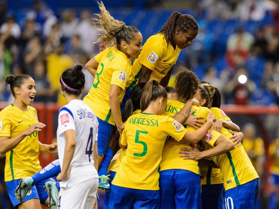 Marta #10 of Brazil celebrates a goal on a penalty kick with teammates in the second half during the 2015 FIFA Women's World Cup Group E match against Korea Republic at Olympic Stadium in Montreal, Quebec, Canada on Tuesday.