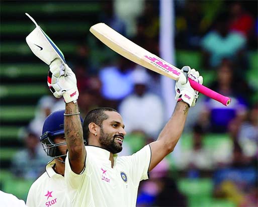 Shikhar Dhawan celebrates his third Test century against Bangladesh on the 1st day of only Test at Fatullah on Wednesday.