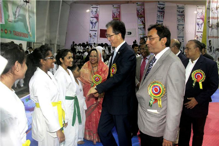 Korean Ambassador to Bangladesh Lee Yun Young being introduced with the participants of the Korea Ambassador Cup Taekwondo Championship at the Gymnasium of National Sports Council on Thursday.