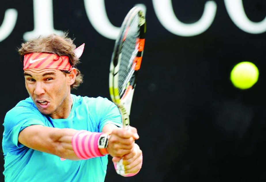 Spain's Rafael Nadal returns the ball to Marcos Baghdatis of Cyprus in their round of sixteen match at the ATP Mercedes Cup tennis tournament in Stuttgart, southern Germany on Thursday.
