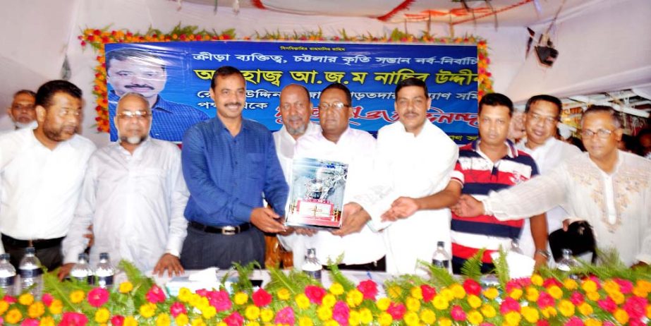 CCC Mayor AJM Nasir Uddin receiving crest from the leaders of Reazuddin Bazar Arotdar Kallyan Samity at a reception accorded to him in the city yesterday.