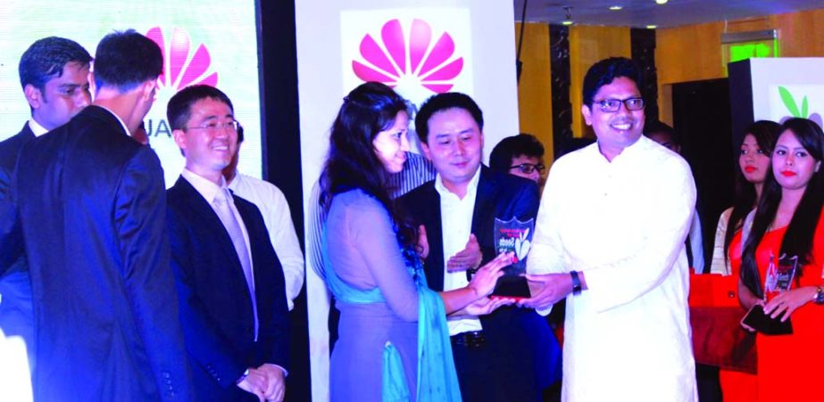 State Minister for ICT, Telecommunications and Information Technology Zunaid Ahmed Palak, presenting award to a winner of 'Seeds for the Future' talent developing program organized by Huawei at a city hotel on Thursday.