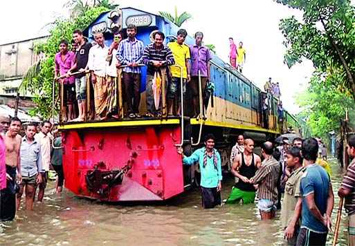 Train services were suspended for several hours as tracks inside Mymensingh town went under water following heaviest rains since Friday.