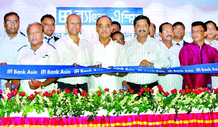 Lt Col Faruk Khan (Retd) Mp, inaugurating the 100th branch of Bank Asia at Muksudpur Upazila in Gopalgonj district on Sunday. Rumee A Hossain, Chairman of EC, Md Mehmood Husain, Managing Director of the bank and Ashraful Alam Shimul, Chairman of Muksudpur