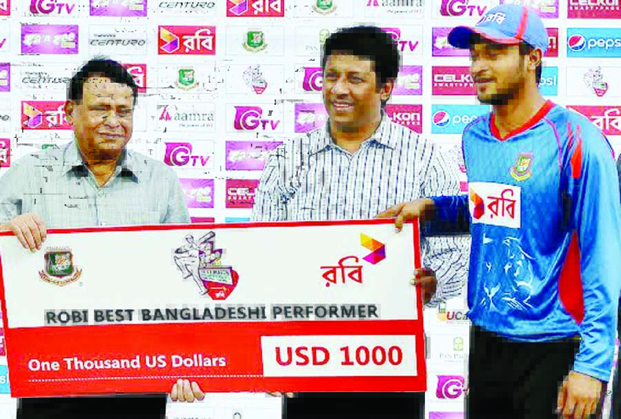 Shakib Al Hasan receiving the best player award of Robi after the lone Test match between Bangladesh and India at the Khan Shaheb Osman Ali Stadium in Fatullah on Sunday.