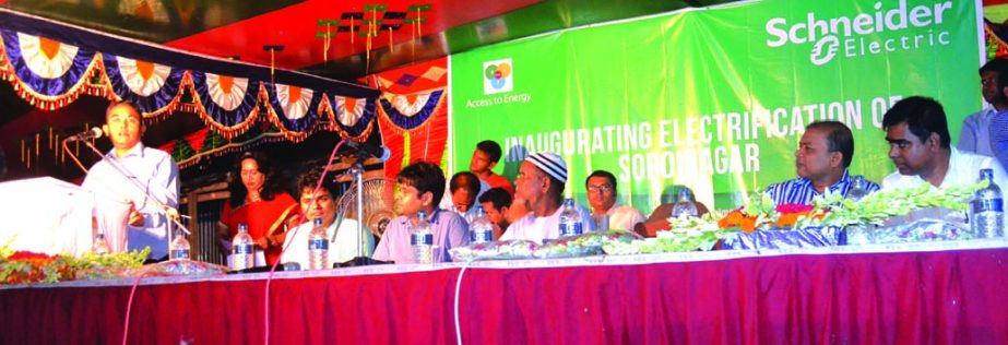 Pradeep Saikia, Country President of Schneider Electric Bangladesh, speaking on the inaugural session of "BipBop Electrification Project" at Soroinagar village in Magura on Monday. Zahir Ahmed, Head of National Sales, Schneider Electric Bangladesh and