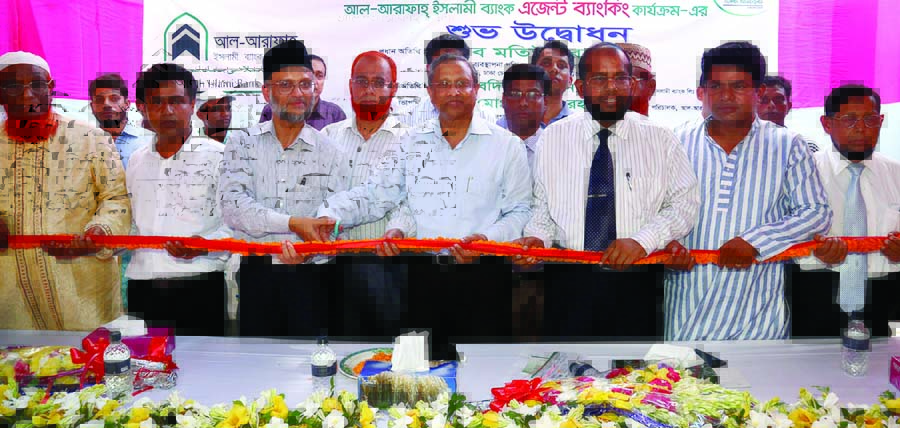 Matiur Rahman, Chairman and Managing Director of Uttara Group of Companies, inaugurating agent banking outlets of Al-Arafah Islami Bank Limited at Chargach Bazar in Brahmanbaria on Tuesday. Managing Director of the bank Md Habibur Rahman presided.