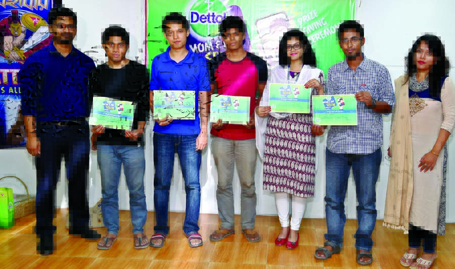 Winners of a "Mom & Me Selfie Contest" pose with their prize organized by Dettol on the occasion of 'Mother's Day', at Reckitt Benckiser Bangladesh Ltd office recently.