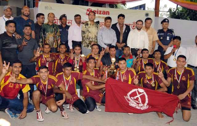 BGB, the champions of the Meizan National Kabaddi Competition with the guests and officials of Bangladesh Kabaddi Federation pose for camera at the Kabaddi Stadium on Tuesday.