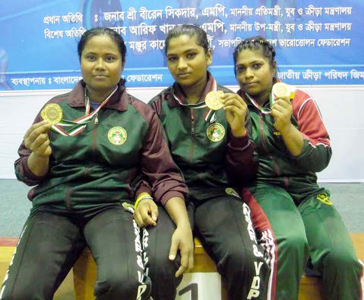 Three record holders of Women's Division of National Club Weightlifting Competition pose for photograph at the Gymnasium of National Sports Council on Tuesday.