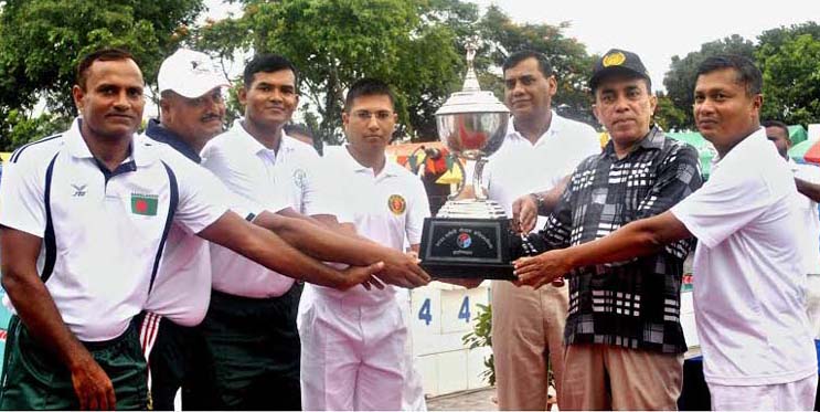 Assistant Chief of Bangladesh Navy Rear Admiral Sayed Abu Mansur Arshadul Abedin handing over the champions trophy to Bangladesh Army, which emerged as the champions of the Inter-Services Swimming, Water Polo, Diving Competitions at the Bangladesh Army S