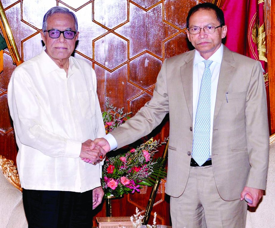 President Abdul Hamid shaking hands with Chief Justice Surendra Kumar Sinha when the latter paid a courtesy call on him at Bangabhaban on Wednesday.