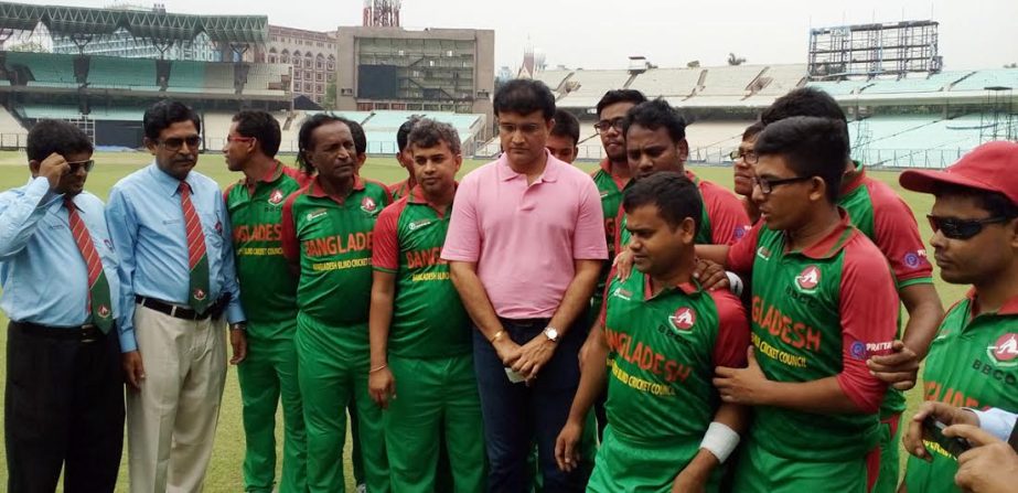 Members of Bangladesh Blind Cricket team with Sourav Ganguly pose for photograph at the Eden Garden in Kolkata on Wednesday.