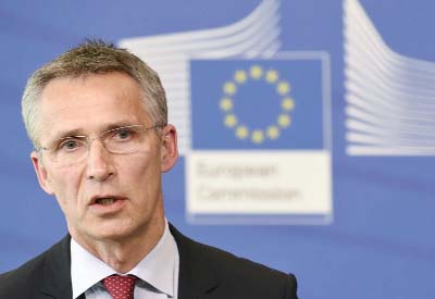 NATO Secretary General Jens Stoltenberg speaks during a press conference at EU headquarters in Brussels.