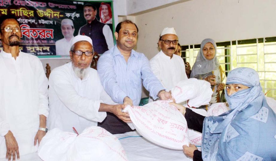 Ward Councilor Ziaul Haq Sumon distributing Ifter items among the distressed people yesterday.