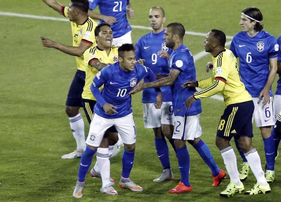 Colombia's Carlos Bacca, second (left) pushes Brazil's Neymar, 10, during a scuffle at the end of a Copa America Group C soccer match at the Monumental stadium in Santiago, Chile on Wednesday. Colombia won the match 1-0.