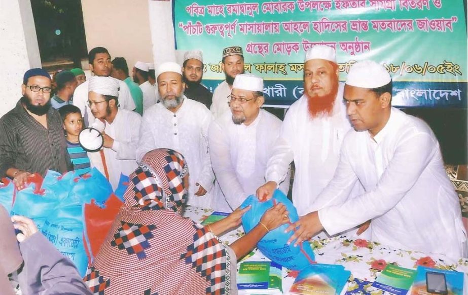 Imam Bukhari (RA) Academy distributing Ifter items among the distressed people in the city yesterday.