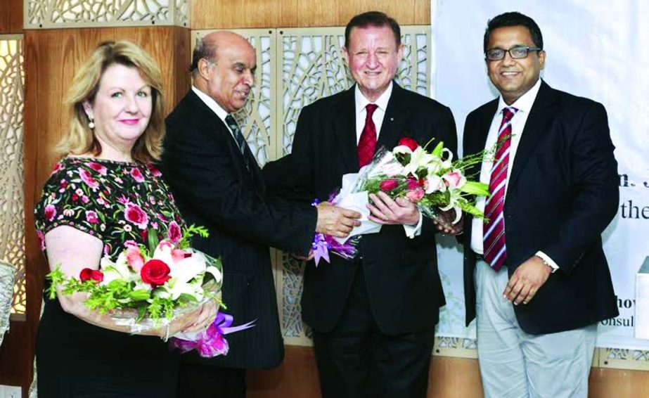 Palestinian Ambassador and Dean of Diplomatic Corps Shaher Mohammad presenting a bouquet to the newly appointed High Commissioner of Malta John Joseph Aquilina, UOM at Gulshan in the city on Friday. Honorary Consul of Malta and FBCCI Director M Shoeb Chow