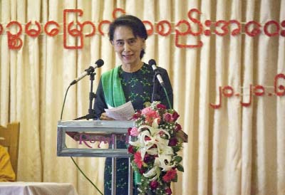 Myanmar opposition leader Aung San Suu Kyi speaks during a meeting of her National League for Democracy Party's first Central Executive Committee at Royal Rose restaurant in Yangon, Myanmar on Saturday.