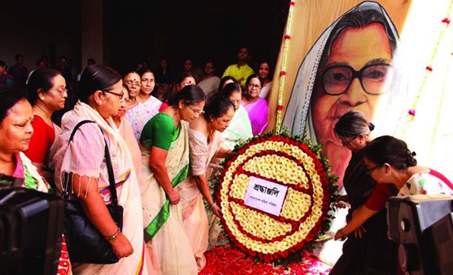 Leading women personalities and members of Mahila Parishad placing wreaths at the portrait of Begum Sufia Kamal marking her 104th birth anniversary on Sunday.