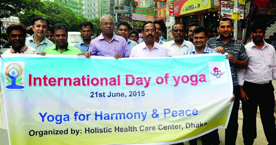 Holistic Health Care Centre, Dhaka brought out a rally marking the International Day of Yoga from city's Panthapath area on Sunday.