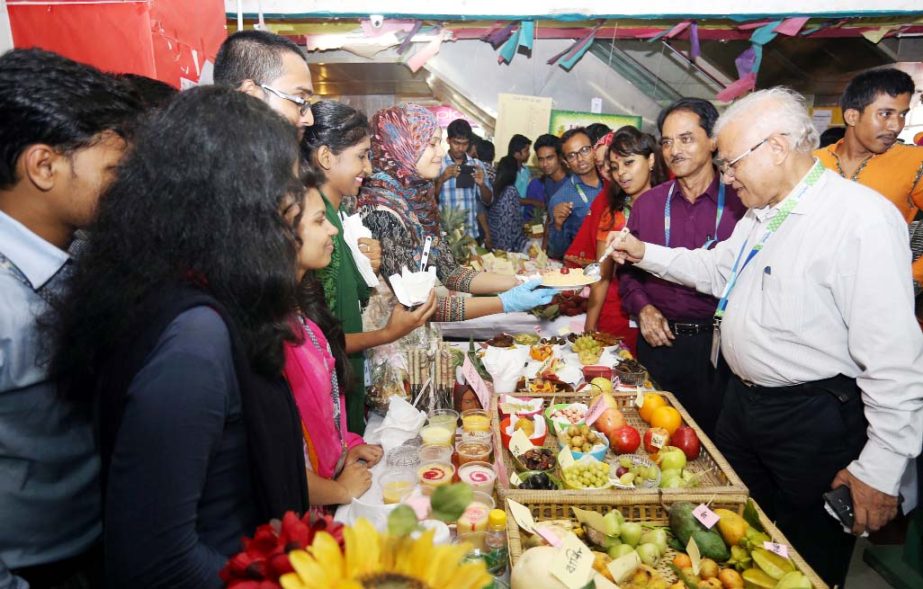 Prof Dr M Lutfar Rahman, Vice Chancellor of Daffodil International University visiting stalls and interacting with students at a fruit festival held on the university campus recently.