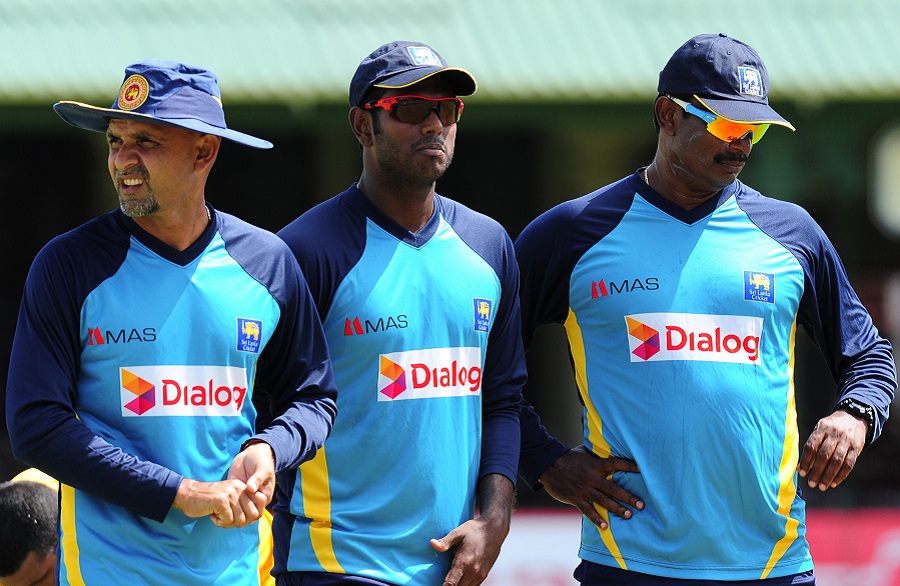 Angelo Mathews watches Sri Lanka's practice session with head coach Marvan Atapattu and bowling coach Champaka Ramanayake in Colombo on Tuesday.