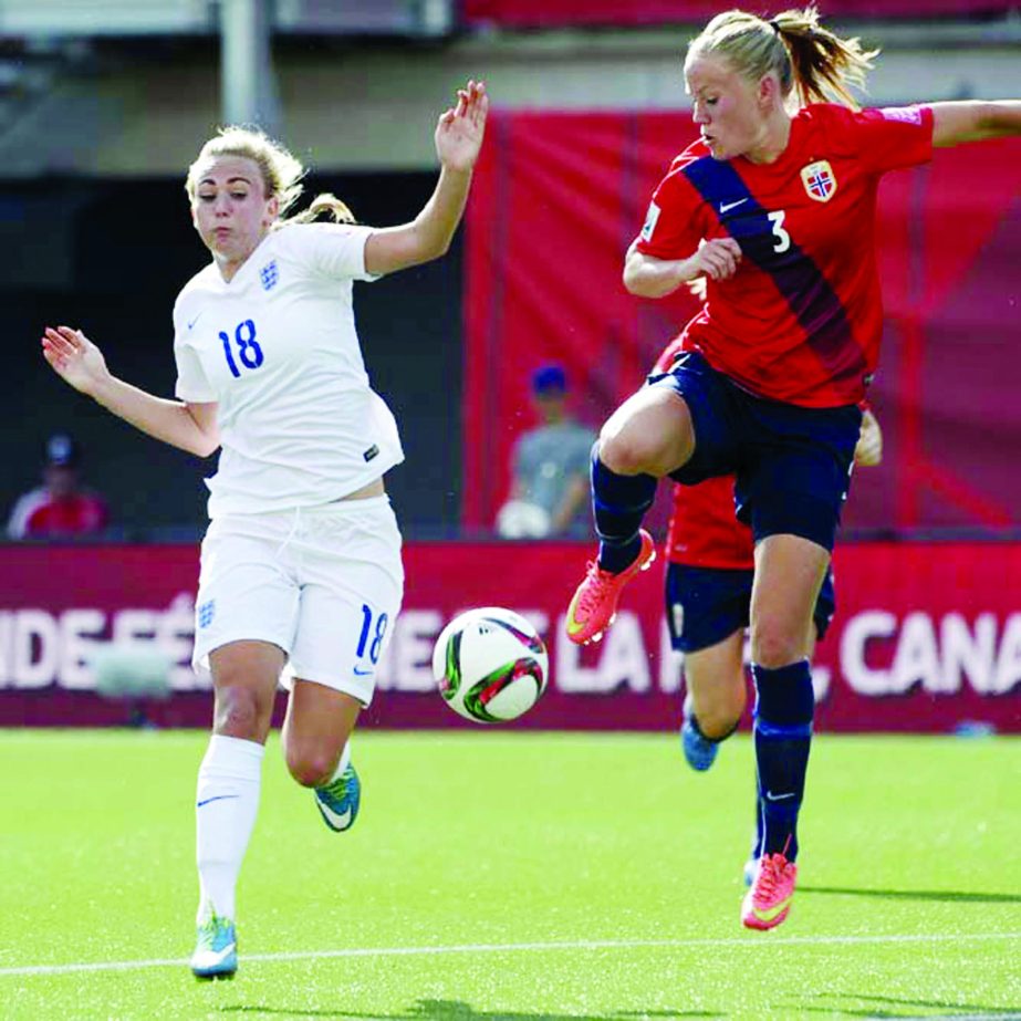 England's Toni Duggan (left) and Norway's Marita Skammelsrud Lund vie for the ball during the first half of a second round soccer game at the FIFA Women's World Cup in Ottawa, Ontario, Canada on Monday.