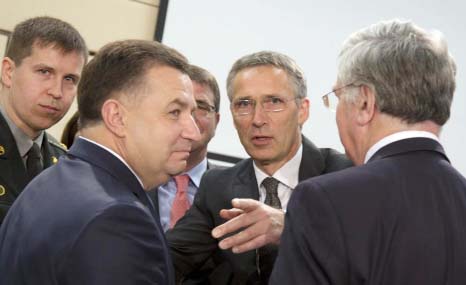 NATO Secretary General Jens Stoltenberg, second right, speaks with Ukraine's Defence Minister Stepan Poltorak, second left, during a meeting of the NATO-Ukraine Commission at NATO headquarters in Brussels on Thursday.