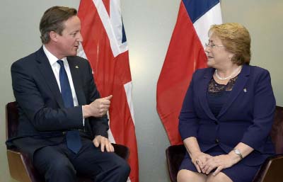 British Prime Minister David Cameron, left, meets with Chile's President Michelle Bachelet on the sidelines of the EU-CELAC summit in Brussels on Wednesday.