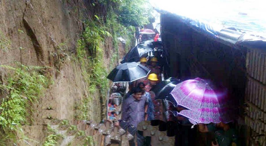 The evicted 50 families from the risky hill pockets of Motijharna Hill in Lalkhan Bazar area in city are being taken to safer place yesterday.