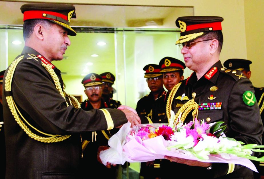 Outgoing Army Chief General Iqbal Karim Bhuiyan shaking hands with new Army Chief Lt Gen Abu Belal Muhammad Shafiul Huq giving a bouquet when the former greeted the latter at the Army Headquarters on Thursday.