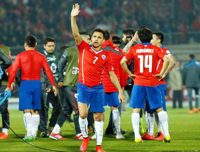 Chile's Alexis Sanchez celebrates at the end of the match against Uruguay during a Copa America quarterfinal soccer match at the National Stadium in Santiago, Chile on Wednesday.